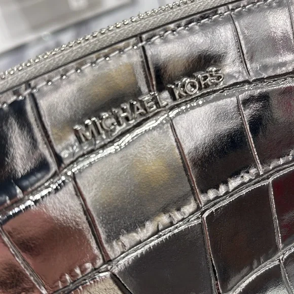 Michael Kors Empire Sm Metallic Crocodile Embossed Leather Travel Pouch
Silver - Picture 7 of 16